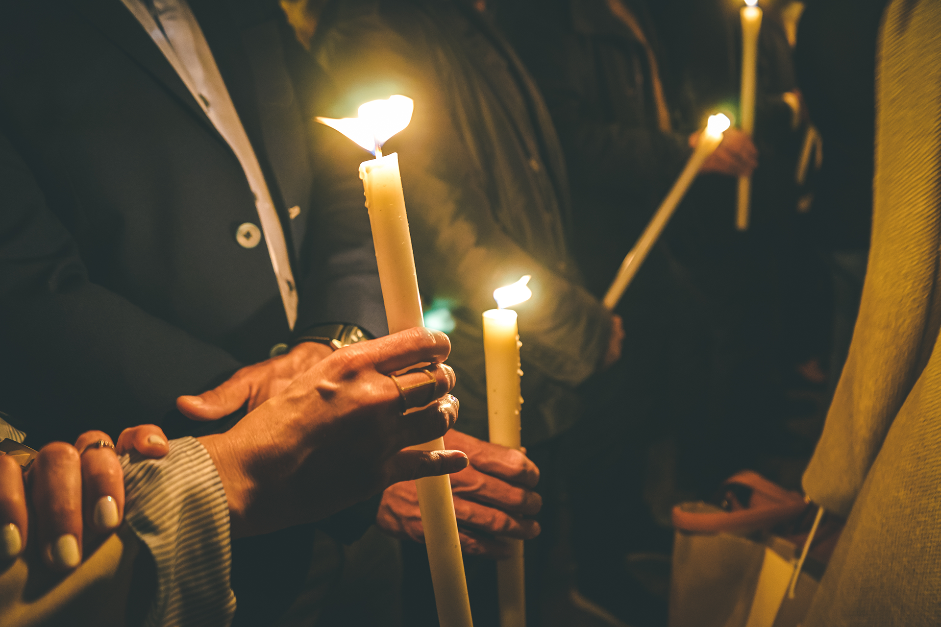 The spiritual moment of people in the church receiving the holy light during Easter in Cyprus.