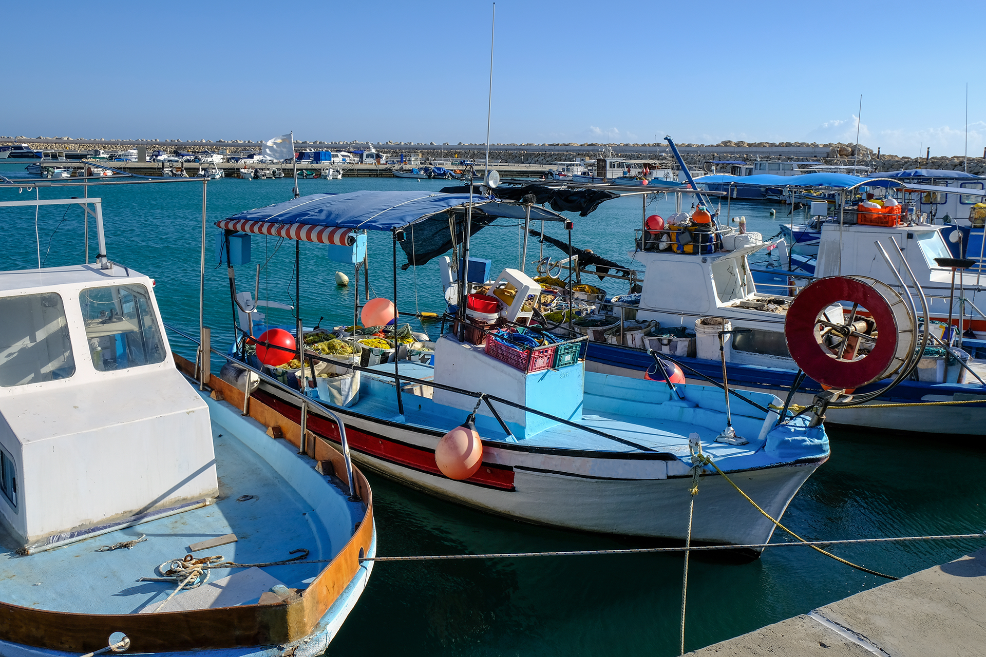 Zygi is a scenic delight with its fishing boats bobbing in the clear blue waters, adding to its rustic beauty
