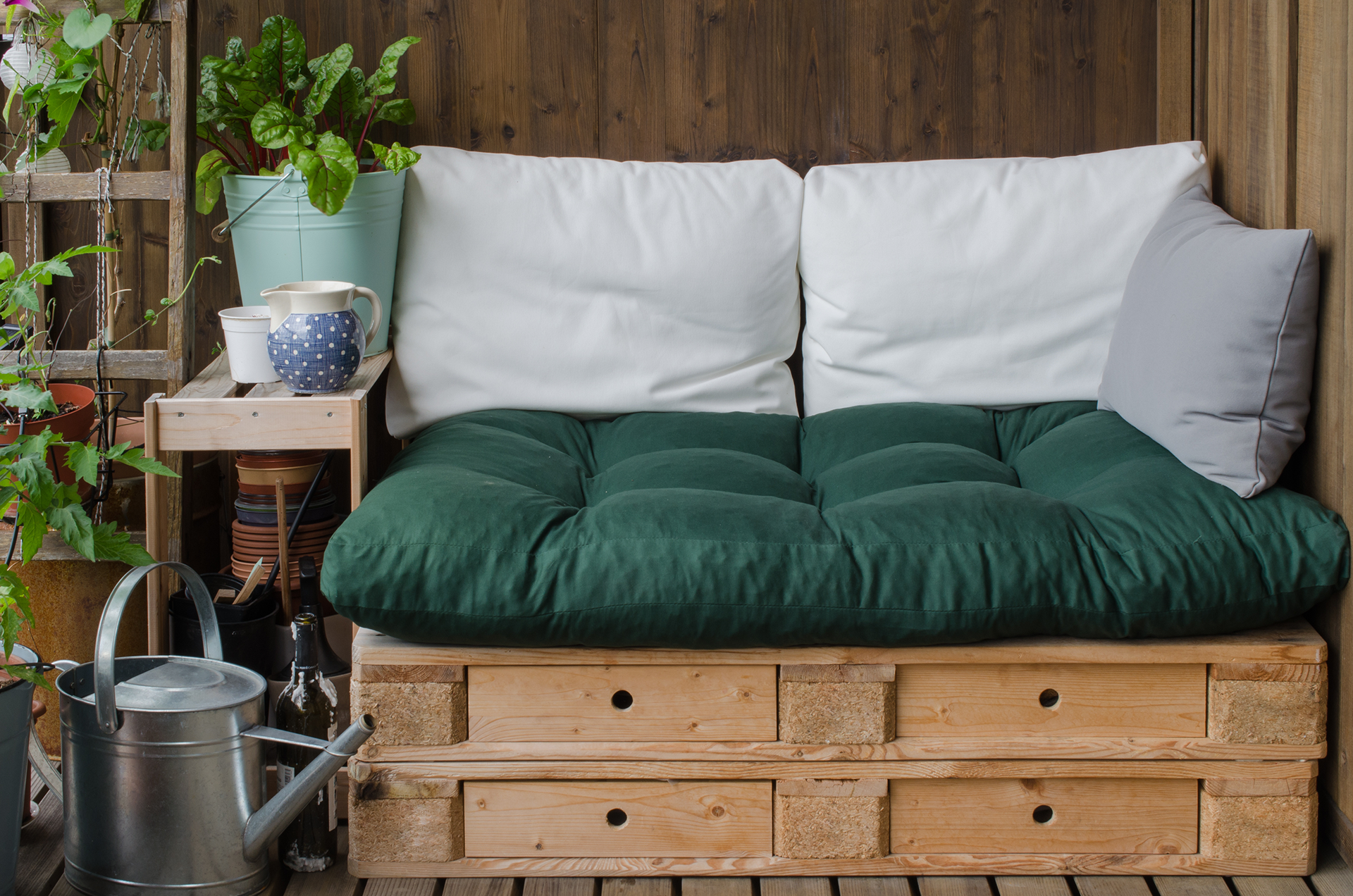 A versatile sitting area that doubles as smart storage, making the most of the small balcony space