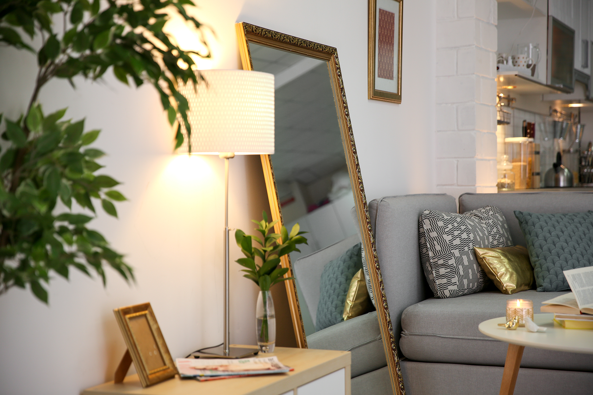 A strategically placed mirror in home spaces creates the illusion of a larger room while adding to the decor