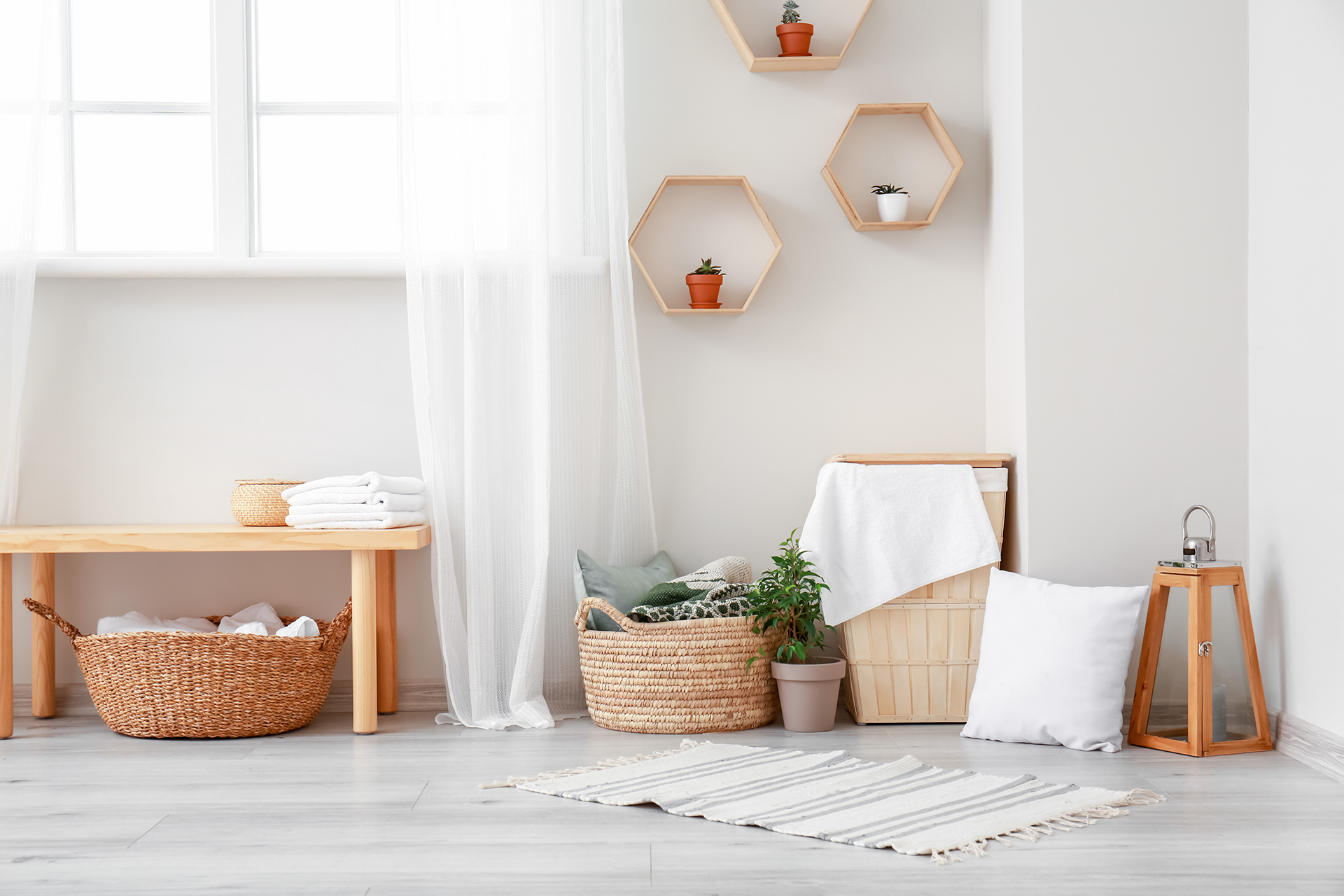 Using decorative storage baskets serves a dual purpose of maintaining a tidy living space while adding a touch of chicness to the home